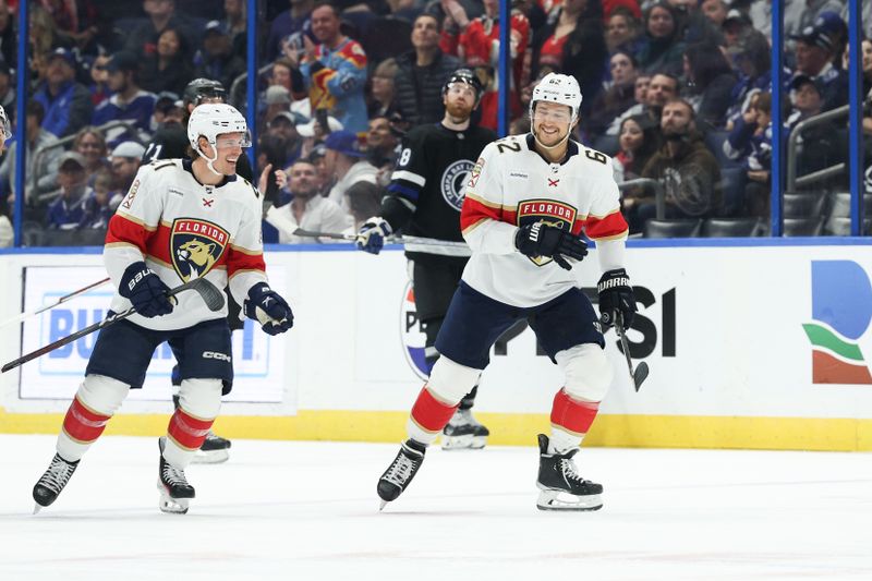 Feb 17, 2024; Tampa, Florida, USA;  Florida Panthers defenseman Brandon Montour (62) celebrates after scoring a goal against the Tampa Bay Lightning in the first period at Amalie Arena. Mandatory Credit: Nathan Ray Seebeck-USA TODAY Sports