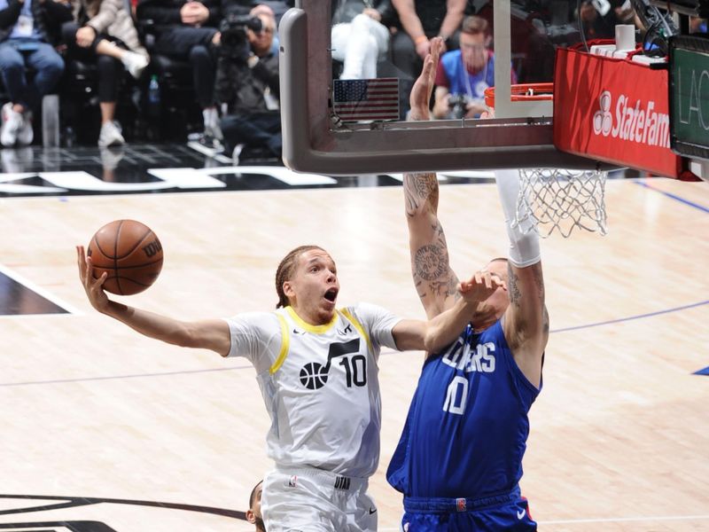 LOS ANGELES, CA - APRIL 12: Jason Preston #10 of the Utah Jazz drives to the basket during the game against the LA Clippers on April 12, 2024 at Crypto.Com Arena in Los Angeles, California. NOTE TO USER: User expressly acknowledges and agrees that, by downloading and/or using this Photograph, user is consenting to the terms and conditions of the Getty Images License Agreement. Mandatory Copyright Notice: Copyright 2024 NBAE (Photo by Adam Pantozzi/NBAE via Getty Images)