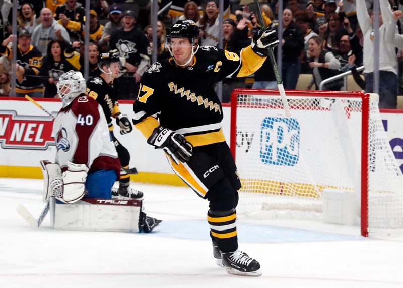 Oct 26, 2023; Pittsburgh, Pennsylvania, USA; Pittsburgh Penguins center Sidney Crosby (87) reacts after scoring a goal against Colorado Avalanche goaltender Alexandar Georgiev (40) during the third period at PPG Paints Arena. The Penguins shutout the Avalanche 4-0. Mandatory Credit: Charles LeClaire-USA TODAY Sports