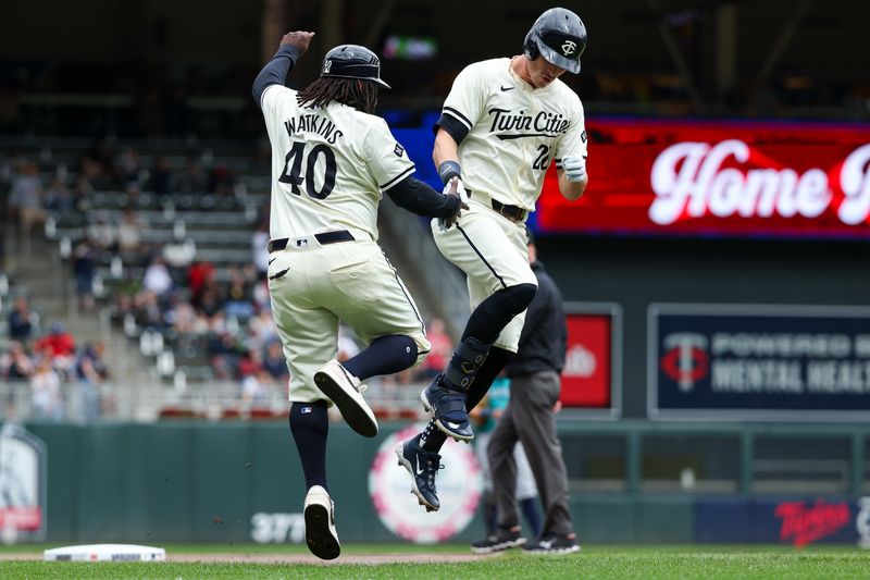 May 9, 2024; Minneapolis, Minnesota, USA; Minnesota Twins designated hitter Max Kepler (26) celebrates his solo home run with third base coach Tommy Watkins (40) during the seventh inning against the Seattle Mariners at Target Field. Mandatory Credit: Matt Krohn-USA TODAY Sports