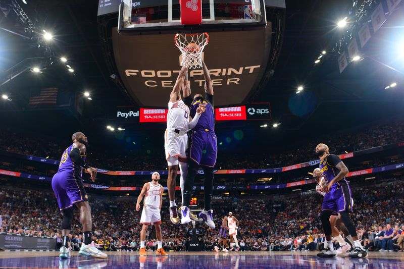 PHOENIX, AZ - OCTOBER 28: Anthony Davis #3 of the Los Angeles Lakers rebounds the ball during the game against the Phoenix Suns on October 28, 2024 at Footprint Center in Phoenix, Arizona. NOTE TO USER: User expressly acknowledges and agrees that, by downloading and or using this photograph, user is consenting to the terms and conditions of the Getty Images License Agreement. Mandatory Copyright Notice: Copyright 2024 NBAE (Photo by Kate Frese/NBAE via Getty Images)