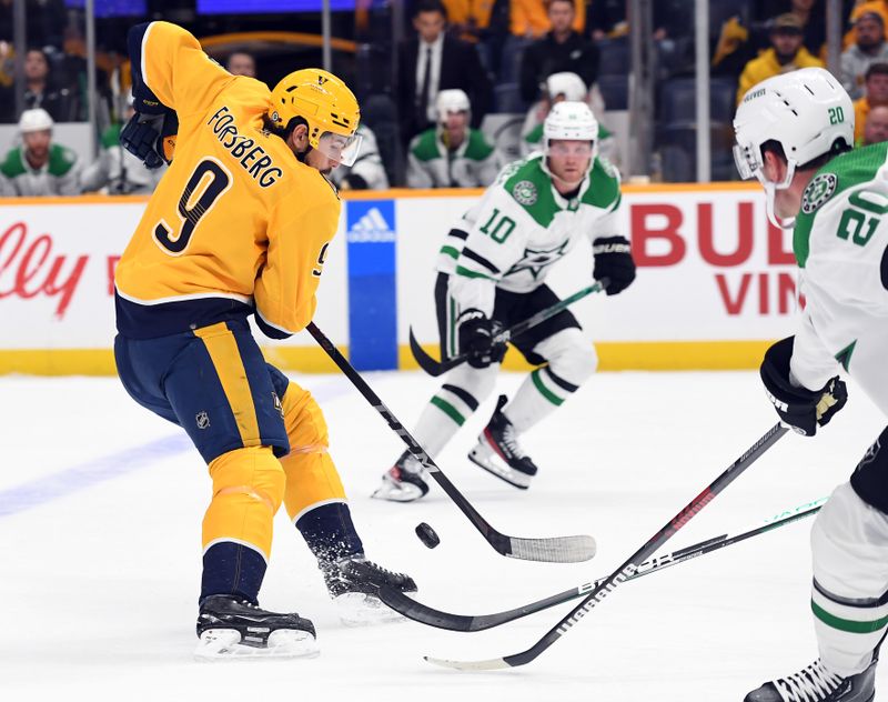 Oct 13, 2022; Nashville, Tennessee, USA; Nashville Predators left wing Filip Forsberg (9) skates the puck into the offensive zone during the first period against the Dallas Stars at Bridgestone Arena. Mandatory Credit: Christopher Hanewinckel-USA TODAY Sports