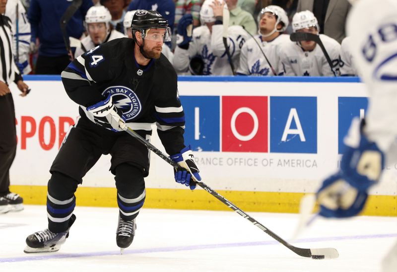 Apr 17, 2024; Tampa, Florida, USA; Tampa Bay Lightning defenseman Calvin de Haan (44) skates with the puck against the Toronto Maple Leafs during the third period at Amalie Arena. Mandatory Credit: Kim Klement Neitzel-USA TODAY Sports