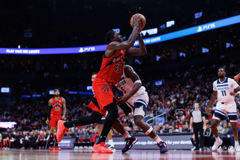 TORONTO, CANADA - OCTOBER 25: Pascal Siakam #43 of the Toronto Raptors goes to the net against Anthony Edwards #5 of the Minnesota Timberwolves during the second half of their NBA game at Scotiabank Arena on October 25, 2023 in Toronto, Canada. NOTE TO USER: User expressly acknowledges and agrees that, by downloading and or using this photograph, User is consenting to the terms and conditions of the Getty Images License Agreement. (Photo by Cole Burston/Getty Images)