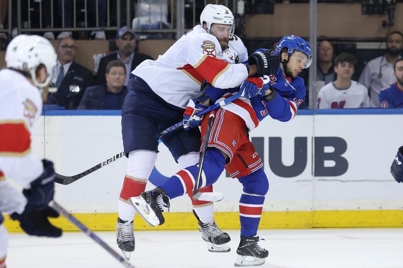 May 22, 2024; New York, New York, USA; Florida Panthers defenseman Aaron Ekblad (5) hits New York Rangers left wing Artemi Panarin (10) during the first period of game one of the Eastern Conference Final of the 2024 Stanley Cup Playoffs at Madison Square Garden. Mandatory Credit: Brad Penner-USA TODAY Sports