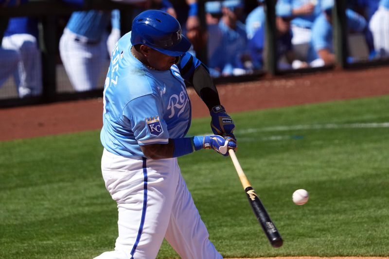 Mar 11, 2024; Surprise, Arizona, USA; Kansas City Royals catcher Salvador Perez (13) bats against the San Francisco Giants during the second inning at Surprise Stadium. Mandatory Credit: Joe Camporeale-USA TODAY Sports