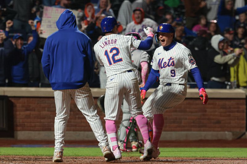 May 12, 2024; New York City, New York, USA; New York Mets left fielder Brandon Nimmo (9) celebrates with shortstop Francisco Lindor (12) after hitting a walk-off two run home run to defeat the Atlanta Braves at Citi Field. Mandatory Credit: Vincent Carchietta-USA TODAY Sports