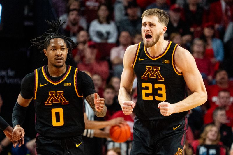 Feb 25, 2024; Lincoln, Nebraska, USA; Minnesota Golden Gophers forward Parker Fox (23) celebrates after dunking the ball against the Nebraska Cornhuskers during the first half at Pinnacle Bank Arena. Mandatory Credit: Dylan Widger-USA TODAY Sports