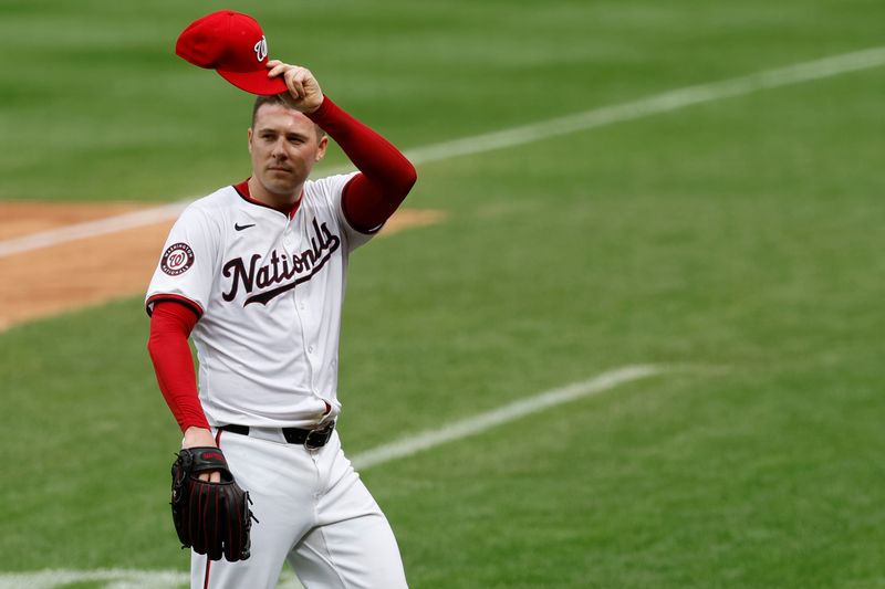 Sep 26, 2024; Washington, District of Columbia, USA; Washington Nationals pitcher Patrick Corbin (46) waves to the crowd while leaving the field against the Kansas City Royals during the sixth inning in what is likely his final start for the Nationals at Nationals Park. Mandatory Credit: Geoff Burke-Imagn Images