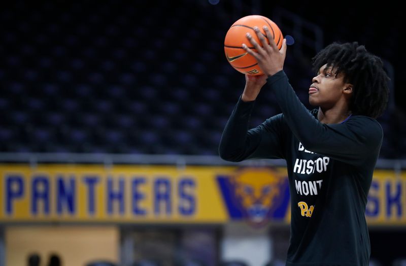 Feb 17, 2024; Pittsburgh, Pennsylvania, USA;  Pittsburgh Panthers guard Carlton Carrington (7) warms up before a game against the Louisville Cardinals at the Petersen Events Center. Mandatory Credit: Charles LeClaire-USA TODAY Sports