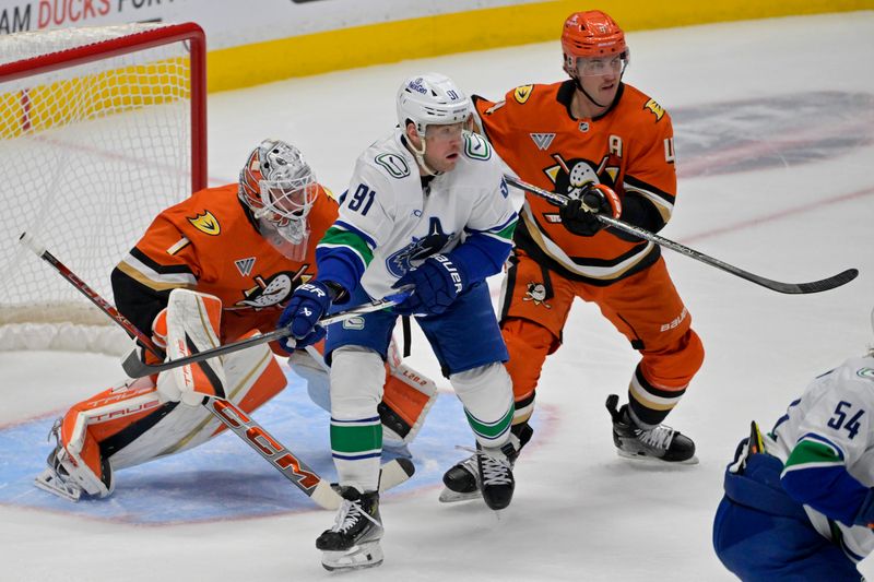 Nov 5, 2024; Anaheim, California, USA; Vancouver Canucks right wing Daniel Sprong (91) and Anaheim Ducks defenseman Cam Fowler (4) fight for position in front of the net in the first period at Honda Center. Mandatory Credit: Jayne Kamin-Oncea-Imagn Images