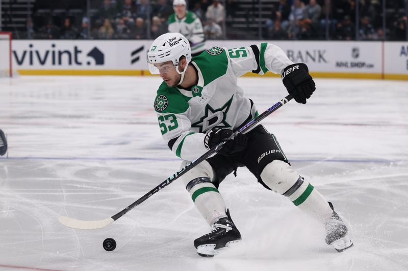 Jan 15, 2026; Salt Lake City, Utah, USA; Dallas Stars center Wyatt Johnston (53) skates with the puck against the Utah Mammoth at Delta Center. Mandatory Credit: Rob Gray-Imagn Images
