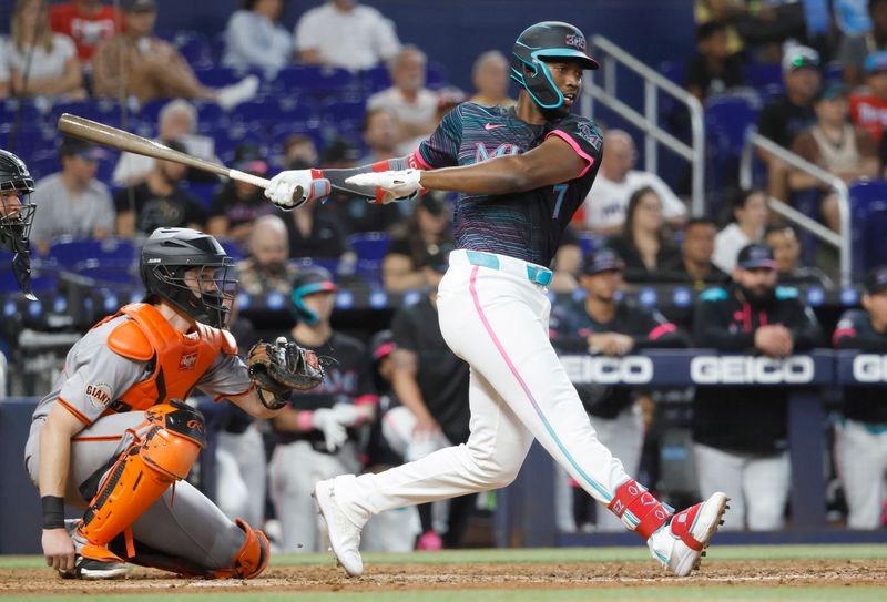 May 31, 2025; Miami, Florida, USA;  Miami Marlins right fielder Jesus Sanchez (7) follows through on his single against the San Francisco Giants during the eighth inning at loanDepot Park. Mandatory Credit: Rhona Wise-Imagn Images