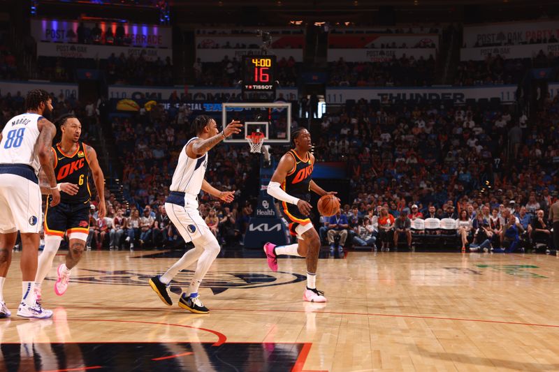 OKLAHOMA CITY, OK - APRIL 14:  Jalen Williams #8 of the Oklahoma City Thunder dribbles the ball during the game against the Dallas Mavericks on April 14, 2024 at Paycom Arena in Oklahoma City, Oklahoma. NOTE TO USER: User expressly acknowledges and agrees that, by downloading and or using this photograph, User is consenting to the terms and conditions of the Getty Images License Agreement. Mandatory Copyright Notice: Copyright 2024 NBAE (Photo by Zach Beeker/NBAE via Getty Images)