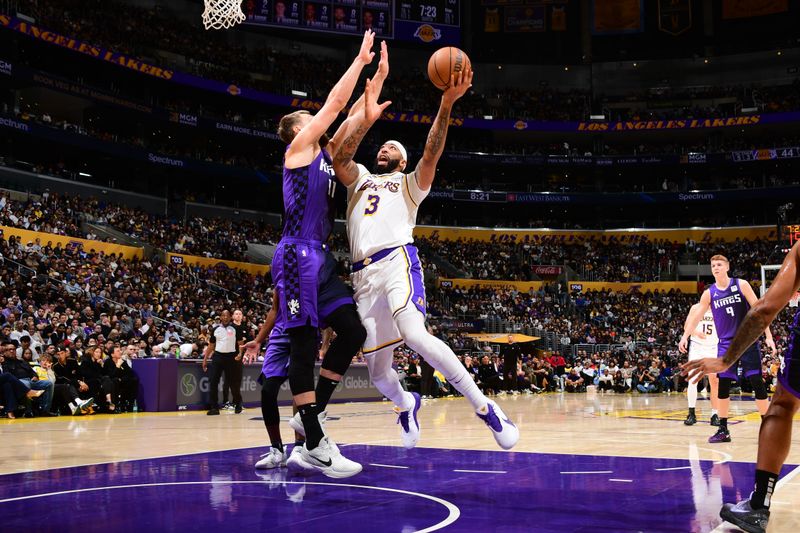 LOS ANGELES, CA - OCTOBER 26: Anthony Davis #3 of the Los Angeles Lakers drives to the basket during the game against the Sacramento Kings on October 26, 2024 at Crypto.Com Arena in Los Angeles, California. NOTE TO USER: User expressly acknowledges and agrees that, by downloading and/or using this Photograph, user is consenting to the terms and conditions of the Getty Images License Agreement. Mandatory Copyright Notice: Copyright 2024 NBAE (Photo by Adam Pantozzi/NBAE via Getty Images)