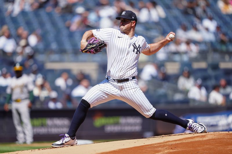 Apr 22, 2024; Bronx, New York, USA; New York Yankees pitcher Carlos Rodon (55) delivers against the Oakland Athletics during the first inning at Yankee Stadium. Mandatory Credit: Gregory Fisher-USA TODAY Sports