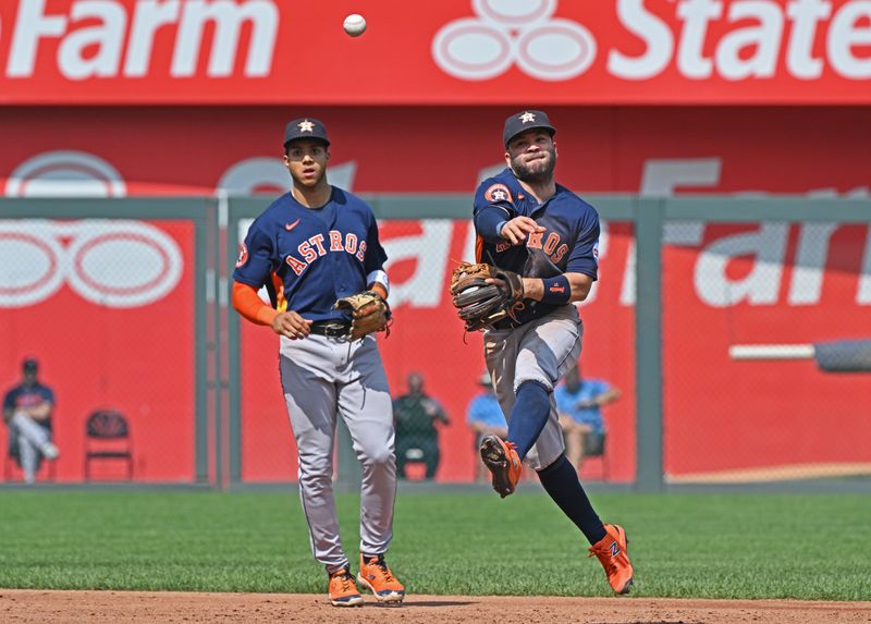 Sep 17, 2023; Kansas City, Missouri, USA; Houston Astros second baseman Jose Altuve (27) throws the ball to first base for an out in the third inning against the Kansas City Royals at Kauffman Stadium. Mandatory Credit: Peter Aiken-USA TODAY Sports