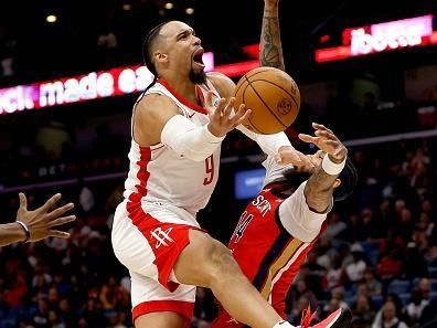 NEW ORLEANS, LOUISIANA - DECEMBER 23: Dillon Brooks #9 of the Houston Rockets is fouled by Brandon Ingram #14 of the New Orleans Pelicans during the third quarter of an NBA game at Smoothie King Center on December 23, 2023 in New Orleans, Louisiana. NOTE TO USER: User expressly acknowledges and agrees that, by downloading and or using this photograph, User is consenting to the terms and conditions of the Getty Images License Agreement. (Photo by Sean Gardner/Getty Images)