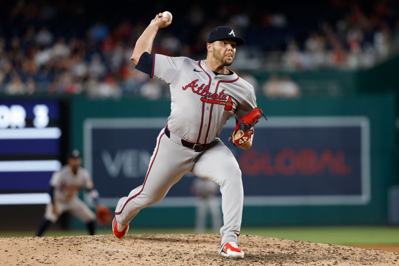 Jun 6, 2024; Washington, District of Columbia, USA; Atlanta Braves relief pitcher Joe Jimenez (77) pitches against the Washington Nationals during the eighth inning at Nationals Park. Mandatory Credit: Geoff Burke-USA TODAY Sports