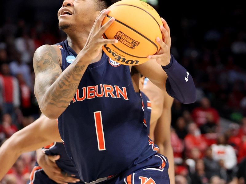 Mar 18, 2023; Birmingham, AL, USA; Auburn Tigers guard Wendell Green Jr. (1) drives to the basket during the second half against the Houston Cougars at Legacy Arena. Mandatory Credit: Vasha Hunt-USA TODAY Sports