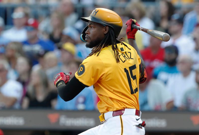 Jul 19, 2024; Pittsburgh, Pennsylvania, USA;  Pittsburgh Pirates shortstop Oneil Cruz (15) hits an RBI double against the Philadelphia Phillies during the first inning at PNC Park. Mandatory Credit: Charles LeClaire-USA TODAY Sports