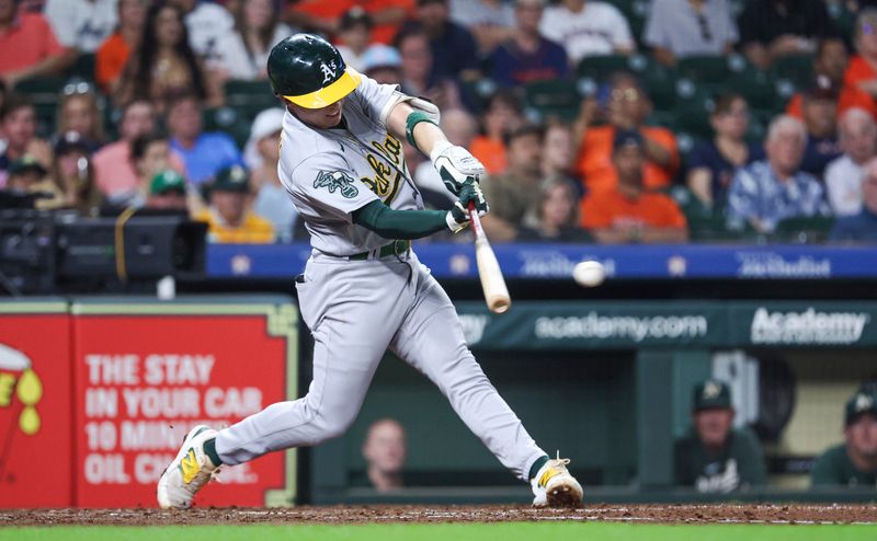 Sep 11, 2023; Houston, Texas, USA; Oakland Athletics shortstop Nick Allen (2) hits an RBI single during the fifth inning against the Houston Astros at Minute Maid Park. Mandatory Credit: Troy Taormina-USA TODAY Sports