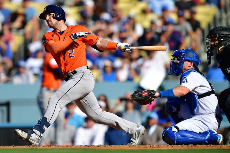 Jun 24, 2023; Los Angeles, California, USA; Houston Astros third baseman Alex Bregman (2) hits a grand slam home run against the Los Angeles Dodgers during the fifth inning at Dodger Stadium. Mandatory Credit: Gary A. Vasquez-USA TODAY Sports