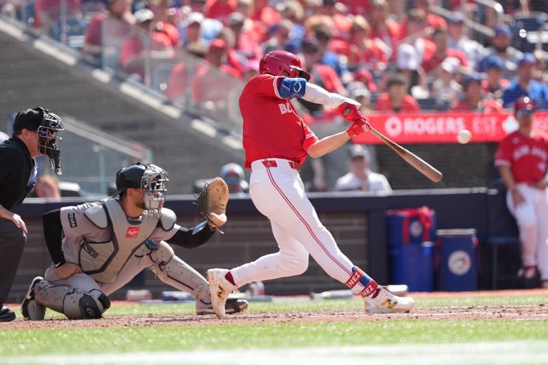 Jul 1, 2025; Toronto, Ontario, CAN; Toronto Blue Jays second baseman Andre Gimenez (0) hits a three run home run against the New York Yankees during the fourth inning at Rogers Centre. Mandatory Credit: Nick Turchiaro-Imagn Images
