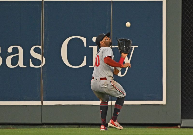 Jul 29, 2023; Kansas City, Missouri, USA;  Minnesota Twins center fielder Willi Castro (50) catches a fly ball during the sixth inning against the Kansas City Royals at Kauffman Stadium. Mandatory Credit: Peter Aiken-USA TODAY Sports