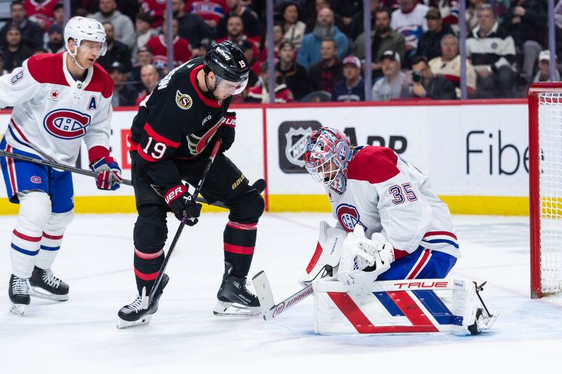 Apr 11, 2025; Ottawa, Ontario, CAN; Montreal Canadiens goalie Sam Montembeault (35) makes a save in front of  Ottawa Senators right wing Drake Batherson  (19) in the first period at the Canadian Tire Centre. Mandatory Credit: Marc DesRosiers-Imagn Images