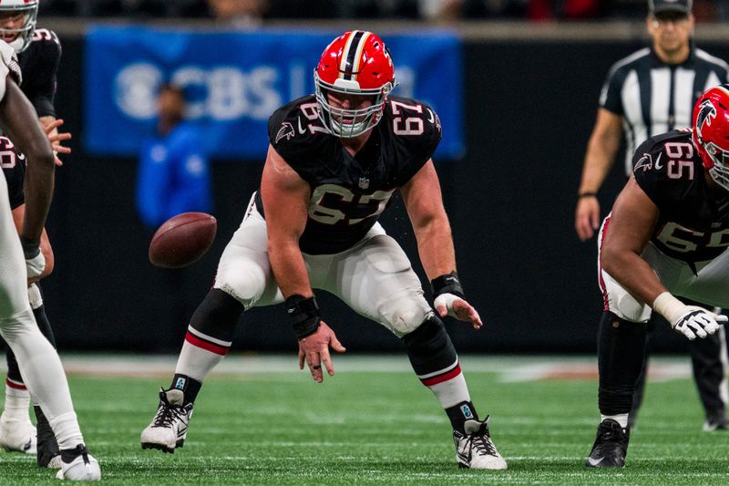 Atlanta Falcons center Drew Dalman (67) works during the second half of an NFL football game against the Washington Commanders, Sunday, Oct. 15, 2023, in Atlanta. The Washington Commanders won 24-16. (AP Photo/Danny Karnik)