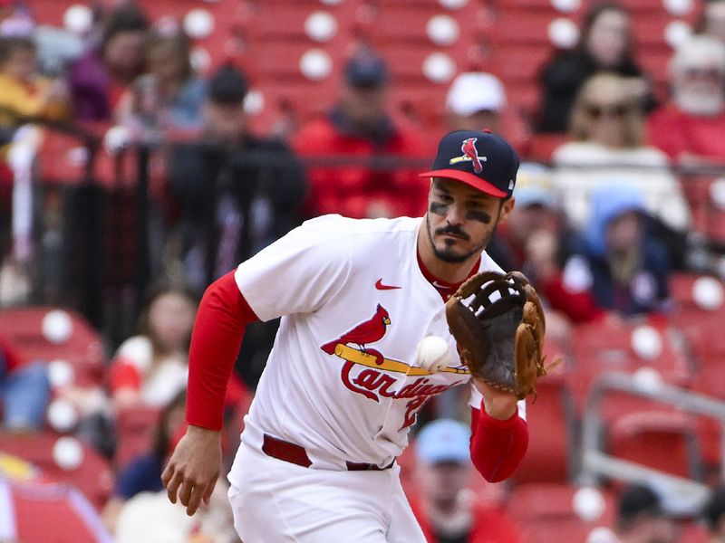 Apr 27, 2025; St. Louis, Missouri, USA;  St. Louis Cardinals third baseman Nolan Arenado (28) fields a ground ball against the Milwaukee Brewers during the fifth inning at Busch Stadium. Mandatory Credit: Jeff Curry-Imagn Images