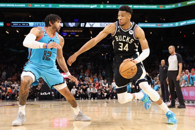 PHOENIX, ARIZONA - MARCH 14: Giannis Antetokounmpo #34 of the Milwaukee Bucks drives the ball against Ish Wainright #12 of the Phoenix Suns during the second half of the NBA game at Footprint Center on March 14, 2023 in Phoenix, Arizona.  The Bucks defeated the Suns 116-104. NOTE TO USER: User expressly acknowledges and agrees that, by downloading and or using this photograph, User is consenting to the terms and conditions of the Getty Images License Agreement.  (Photo by Christian Petersen/Getty Images)