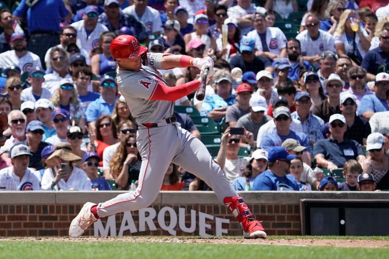 Jul 6, 2024; Chicago, Illinois, USA; Los Angeles Angels catcher Logan O'Hoppe (14) hits a single against the Chicago Cubs during the third inning at Wrigley Field. Mandatory Credit: David Banks-USA TODAY Sports