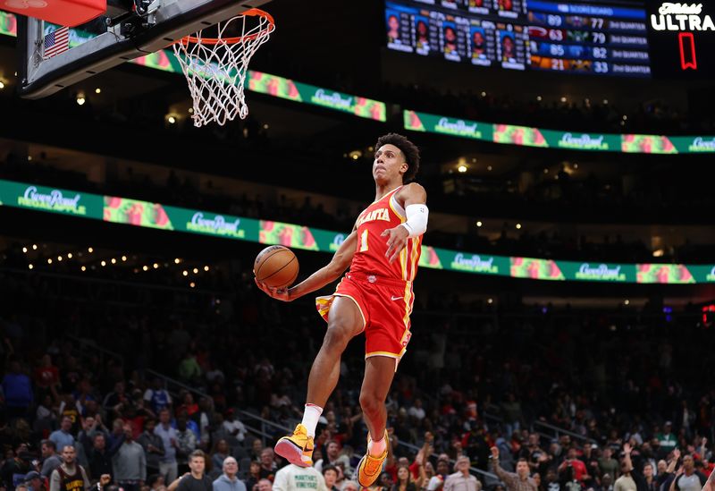 ATLANTA, GEORGIA - OCTOBER 30:  Jalen Johnson #1 of the Atlanta Hawks dunks against the Minnesota Timberwolves during the fourth quarter at State Farm Arena on October 30, 2023 in Atlanta, Georgia.  NOTE TO USER: User expressly acknowledges and agrees that, by downloading and/or using this photograph, user is consenting to the terms and conditions of the Getty Images License Agreement.  (Photo by Kevin C. Cox/Getty Images)