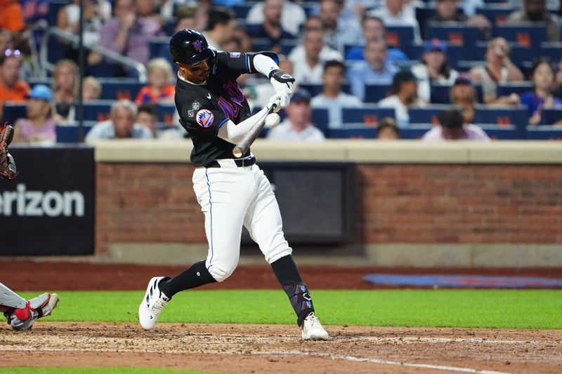 Jul 10, 2024; New York City, New York, USA; New York Mets third baseman Mark Vientos (27) hits a RBI double against the Washington Nationals during the sixth inning at Citi Field. Mandatory Credit: Gregory Fisher-USA TODAY Sports