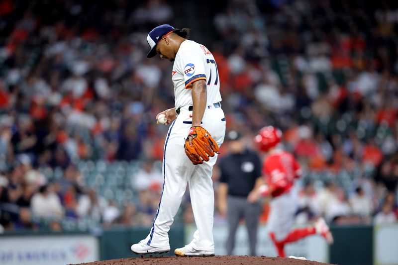 Sep 1, 2025; Houston, Texas, USA; Houston Astros starting pitcher Luis Garcia (77) reacts after giving up a home run to Los Angeles Angels shortstop Zach Neto (9) during the fourth inning at Daikin Park. Mandatory Credit: Erik Williams-Imagn Images