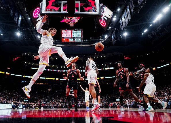 TORONTO, ON - DECEMBER 23: Lauri Markkanen #23 of the Utah Jazz drunks against the Toronto Raptors during the first half of their basketball game at the Scotiabank Arena on December 23, 2023 in Toronto, Ontario, Canada. NOTE TO USER: User expressly acknowledges and agrees that, by downloading and/or using this Photograph, user is consenting to the terms and conditions of the Getty Images License Agreement. (Photo by Mark Blinch/Getty Images)