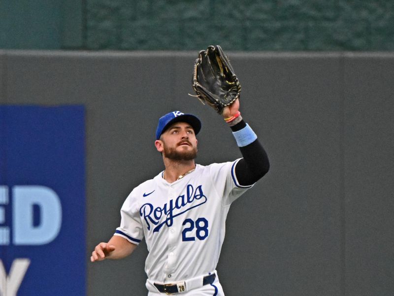 Jun 27, 2024; Kansas City, Missouri, USA; Kansas City Royals center fielder Kyle Isbel (28) catches a fly ball in the first inning against the Cleveland Guardians at Kauffman Stadium. Mandatory Credit: Peter Aiken-USA TODAY Sports