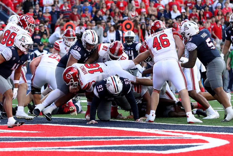 Nov 18, 2023; Tucson, Arizona, USA; Utah Utes quarterback Bryson Barnes (16) dives into the end zone for a touchdown against Arizona Wildcats defensive lineman Jacob Kongaika (93) during the second half at Arizona Stadium. Mandatory Credit: Zachary BonDurant-USA TODAY Sports