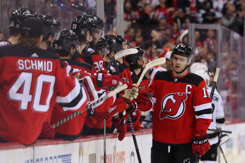 Feb 23, 2023; Newark, New Jersey, USA; New Jersey Devils center Nico Hischier (13) celebrates his goal against the Los Angeles Kings during the third period at Prudential Center. Mandatory Credit: Ed Mulholland-USA TODAY Sports