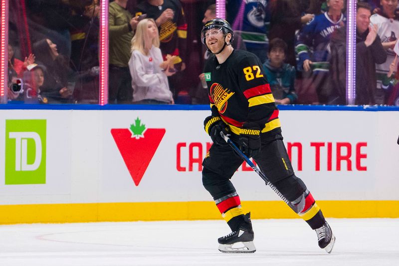 Dec 23, 2023; Vancouver, British Columbia, CAN; Vancouver Canucks defenseman Ian Cole (82) celebrates his gaol against the San Jose Sharks in the second period at Rogers Arena. Mandatory Credit: Bob Frid-USA TODAY Sports