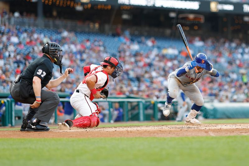 Jun 3, 2024; Washington, District of Columbia, USA; New York Mets shortstop Francisco Lindor (12) is hit by a pitch against the Washington Nationals during the second inning at Nationals Park. Mandatory Credit: Geoff Burke-USA TODAY Sports
