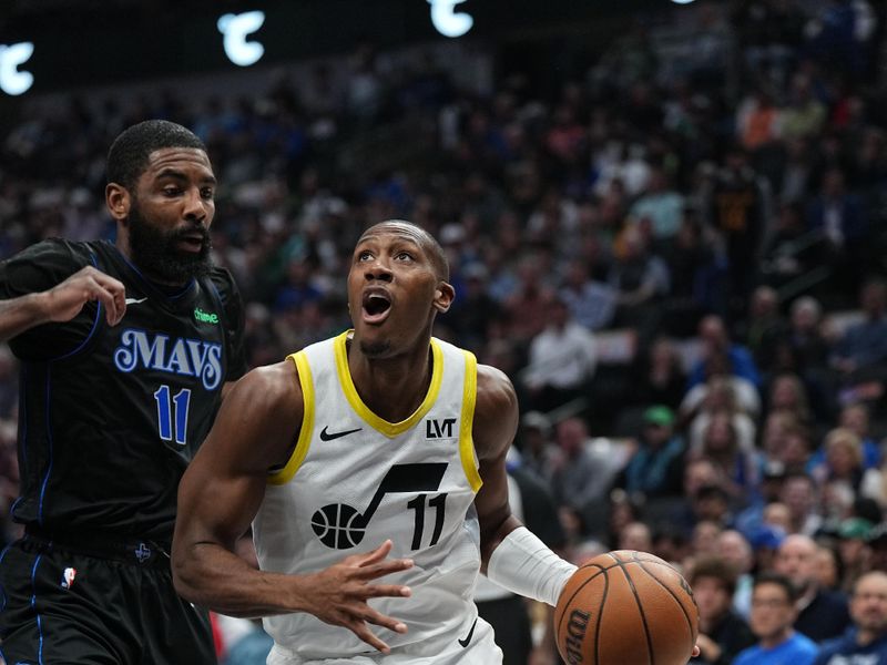 DALLAS, TX - MARCH 21: Kris Dunn #11 of the Utah Jazz dribbles the ball during the game against the Dallas Mavericks on March 21, 2024 at the American Airlines Center in Dallas, Texas. NOTE TO USER: User expressly acknowledges and agrees that, by downloading and or using this photograph, User is consenting to the terms and conditions of the Getty Images License Agreement. Mandatory Copyright Notice: Copyright 2024 NBAE (Photo by Glenn James/NBAE via Getty Images)