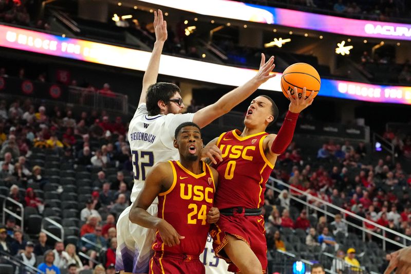 Mar 13, 2024; Las Vegas, NV, USA; USC Trojans guard Kobe Johnson (0) shoots over forward Joshua Morgan (24) and Washington Huskies forward Wilhelm Breidenbach (32) during the second half at T-Mobile Arena. Mandatory Credit: Stephen R. Sylvanie-USA TODAY Sports