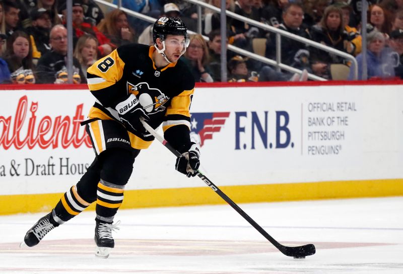 Apr 6, 2024; Pittsburgh, Pennsylvania, USA;  Pittsburgh Penguins left wing Michael Bunting (8) moves the puck against the Tampa Bay Lightning during the third period at PPG Paints Arena. The Penguins won 5-4. Mandatory Credit: Charles LeClaire-USA TODAY Sports