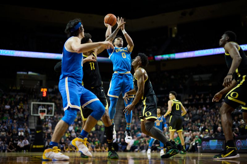 Feb 11, 2023; Eugene, Oregon, USA; UCLA Bruins guard Jaylen Clark (0) shoots a basket during the second half against Oregon Ducks guard Jermaine Couisnard (5) at Matthew Knight Arena. Mandatory Credit: Troy Wayrynen-USA TODAY Sports