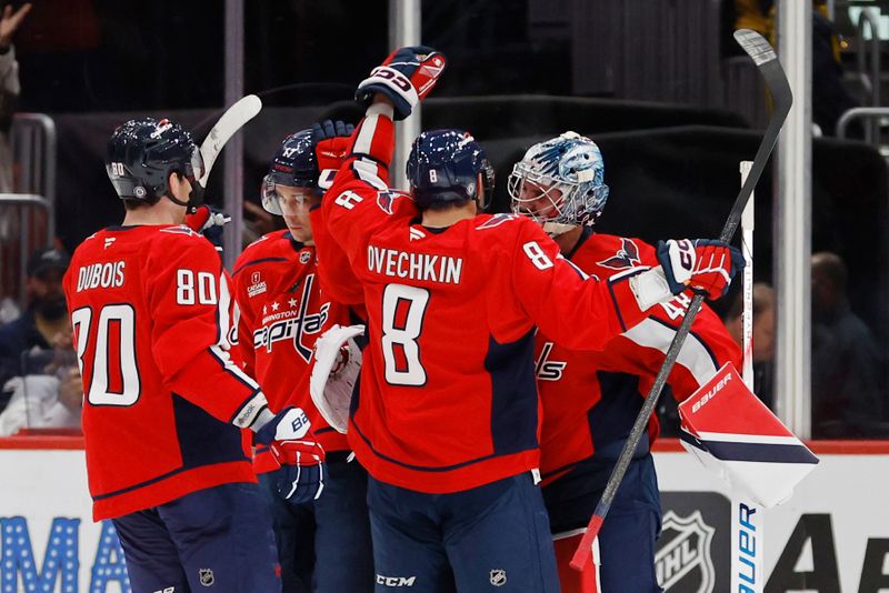 Nov 2, 2024; Washington, District of Columbia, USA; Washington Capitals left wing Alex Ovechkin (8) celebrates with Capitals goaltender Logan Thompson (48) after their game against the Columbus Blue Jackets at Capital One Arena. Mandatory Credit: Geoff Burke-Imagn Images