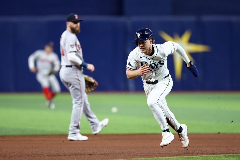 Sep 19, 2024; St. Petersburg, Florida, USA; Tampa Bay Rays shortstop Taylor Walls (6) advances to third base on s wild throw to second base against the Boston Red Sox in the seventh inning at Tropicana Field. Mandatory Credit: Nathan Ray Seebeck-Imagn Images