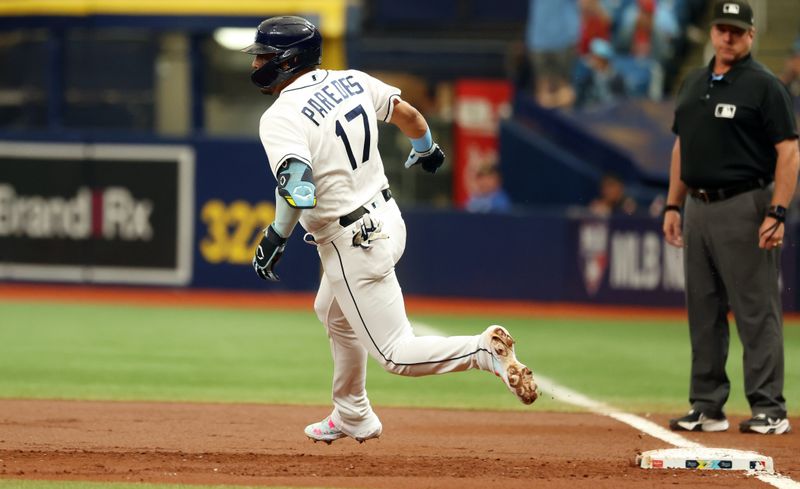 Sep 21, 2023; St. Petersburg, Florida, USA; Tampa Bay Rays third baseman Isaac Paredes (17) hits a RBI double against the Los Angeles Angels at Tropicana Field. Mandatory Credit: Kim Klement Neitzel-USA TODAY Sports